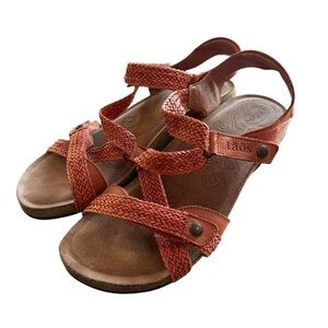 Taos women’s size 10 to 10 1/2 Orange leather top, cork sole sandals.